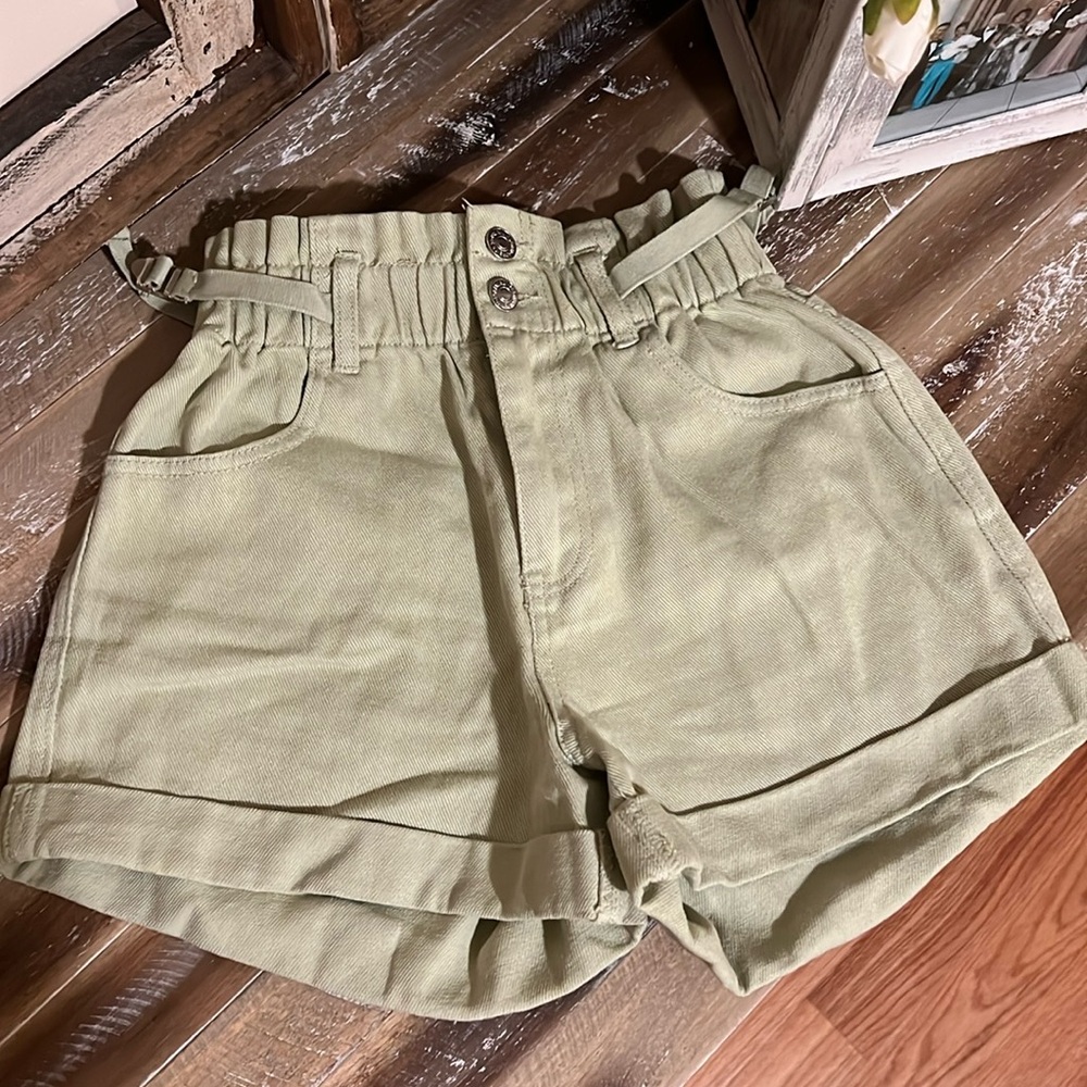 Green jean shorts.